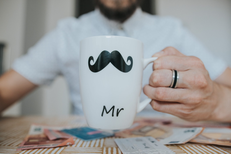 focus, table, furniture, hair, focus on foreground, blurred background, 5K, midsection, person, ring, white, adult, front view, men, number, man, coffee