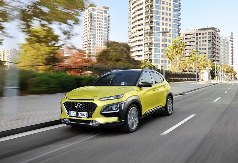 luxury, blurred motion, motor vehicle, architecture, day, yellow, land vehicle, hyundai, car, (2018), tree, city life, building exterior, road, no people