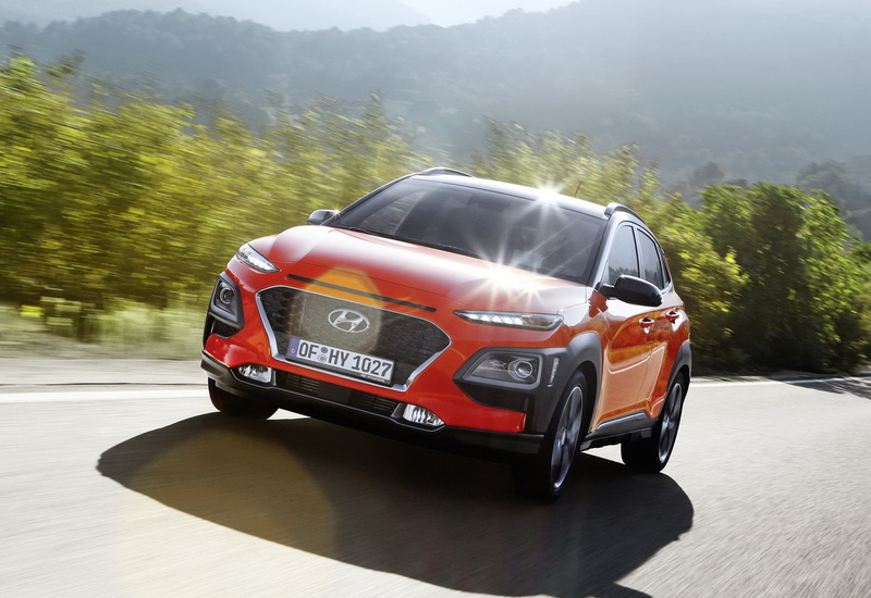 hyundai, land vehicle, luxury, tree, mode of transportation, motor vehicle, car, transportation, red, speed, no people, kona, sunlight, communication, blurred motion