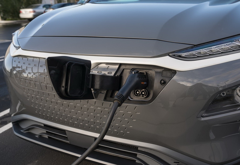 headlight, 720P, luxury, silver colored, metal, transportation, [us], hyundai, day, close-up, electric, stationary, outdoors, travel, air vehicle, vehicle hood