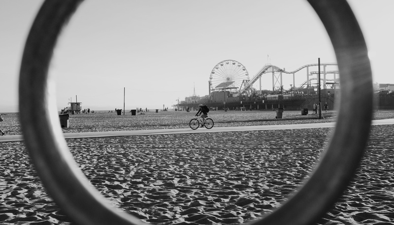 5K, bike, built structure, leisure activity, focus on background, santa monica, lifestyles, person, bicycle, circle, outdoors, riding, ring, day, people