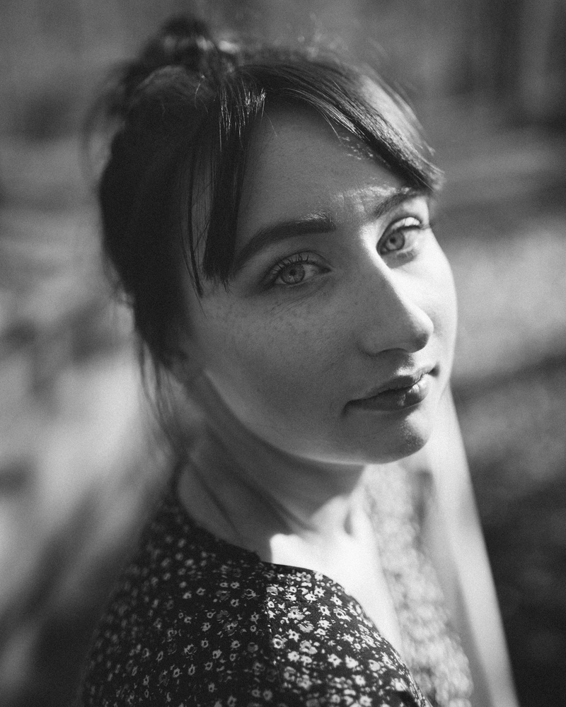 monochromatic, beautiful, bangs, eyes, outdoors, hairstyle, black-and-white, contemplation, real people, girl, black and white, wear, day, 4K, focus on foreground