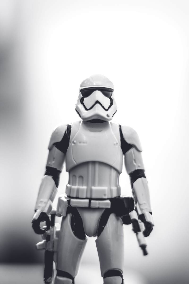 toy, studio shot, representation, mono, black, one person, protection, monochromatic, technology, human representation, stars, star wars, exposure, holding