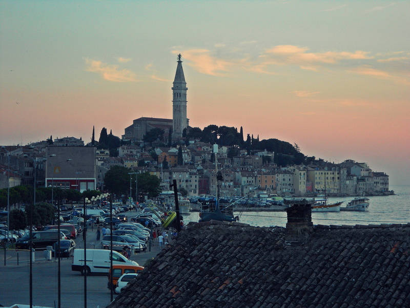 nautical vessel, sea, built structure, cityscape, city, sunset, in the evening, tower, sky, residential district, cloud - sky, no people, travel destinations
