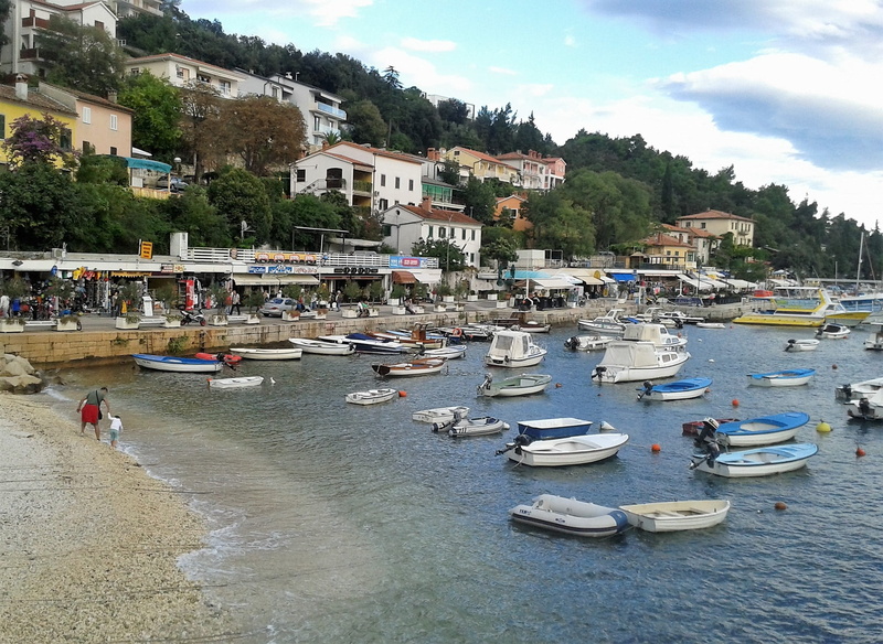 bank, building exterior, shop, moored, sea, port city, coast, outdoors, mode of transportation, sky, recovery, sand, fishing boat, cloud - sky, sailboat
