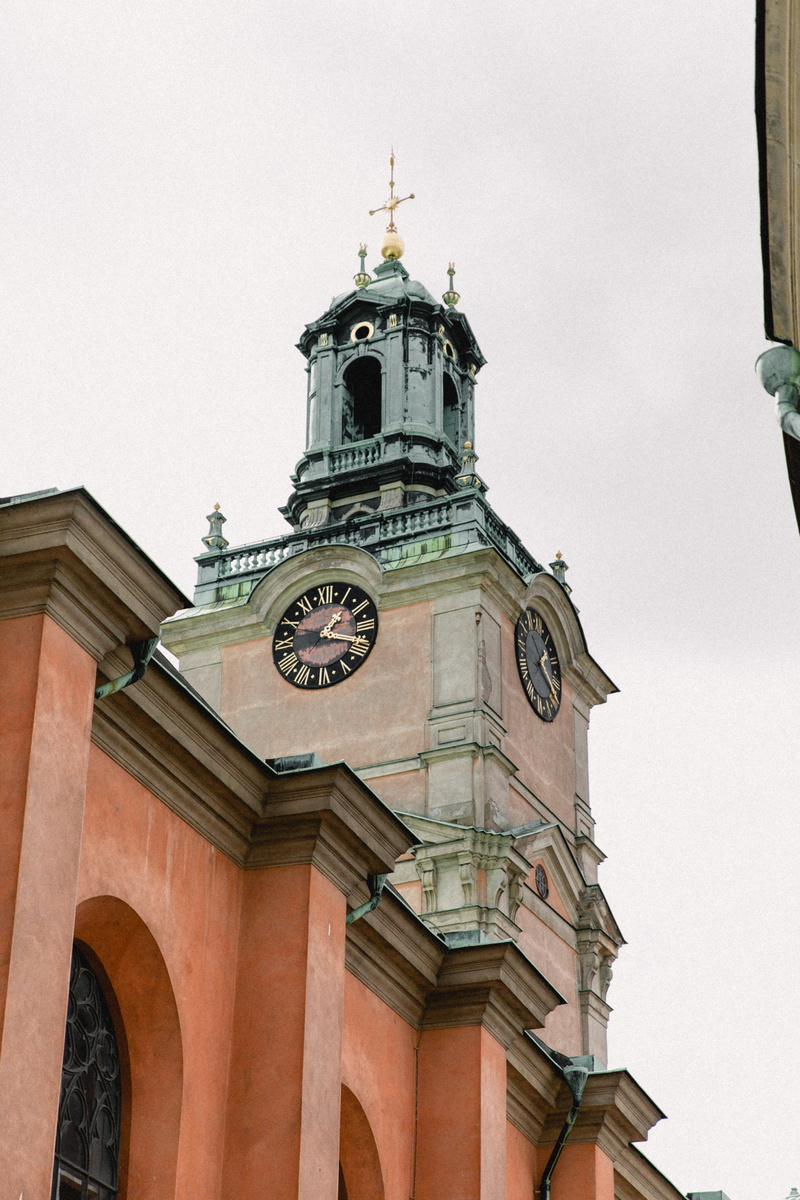 clock tower, religion, spire, church, sweden, time, building, stockholm, tower, roman, built structure, oldtown, clear sky, clock, historical, minute hand