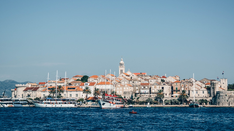 watercraft, building, water, waterfront, transportation, mode of transportation, ferry, sky, tower, daytime, harbor, korčula, coast, korcula old town, nature