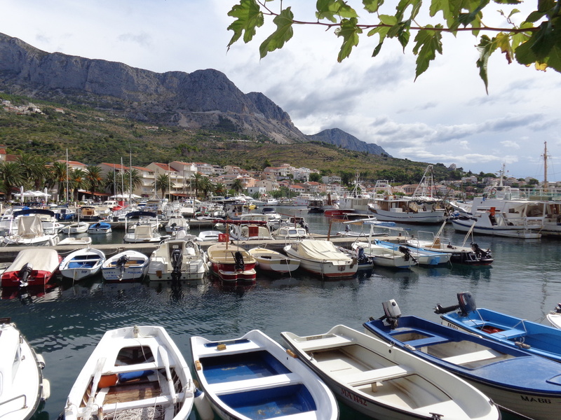 moored, yacht, tree, rocks, harbor, the coast, sky, boat, plant, ship, beauty in nature, cloud - sky, nautical vessel, lake, port, mode of transportation