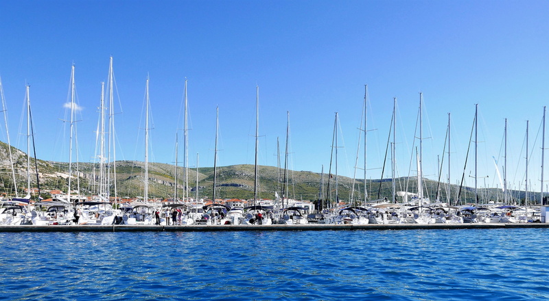 water, moored, sailboat, pole, built structure, sea, nautical vessel, architecture, mode of transportation, day, mast, waterfront, mountains, yacht, nature