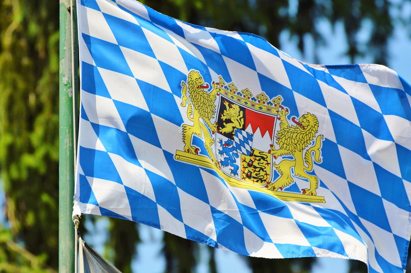bayern flag, tree, wind, blue, shape, striped, day, outdoors, communication, white color, blow, text, environment, flag, bavaria, bavaria flag, low angle view