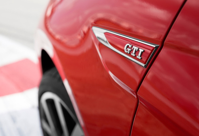 red, transportation, motor vehicle, mode of transportation, day, fuel and power generation, sports car, land vehicle, text, car, volkswagen, vibrant color