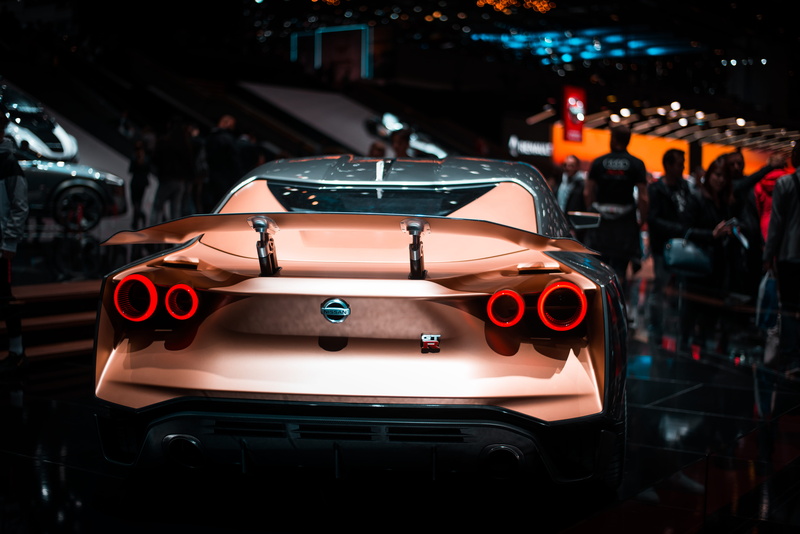 sports car, architecture, standing, vehicle, incidental people, luxury, auto, modern, real people, group of people, land vehicle, outdoors, transportation system