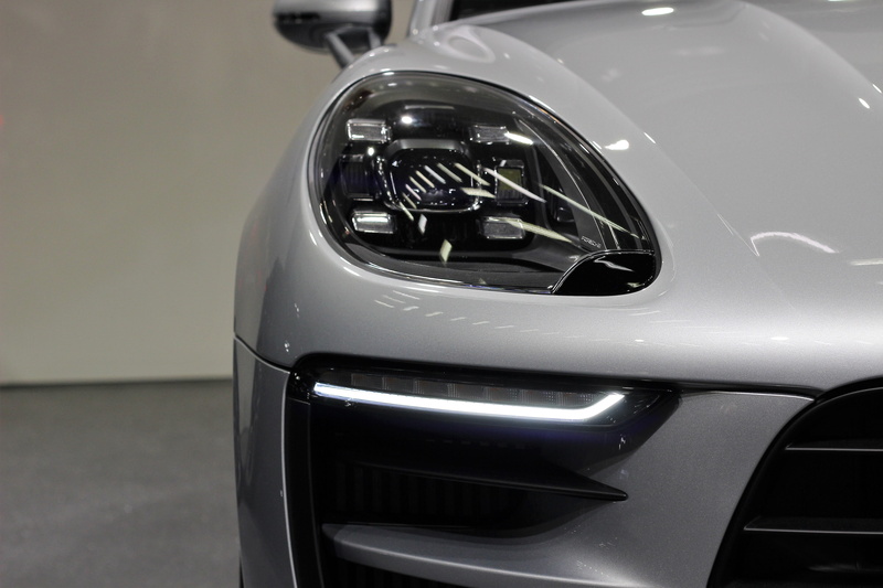 5K, mode of transportation, stationary, reflection, modern, silver colored, indoors, lighting equipment, no people, chrome, porsche macan gts, power, sport
