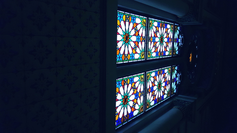 wall - building feature, dark, stained glass, low angle view, indoors, no people, window, design, glass, pattern, wall, shape, building, architecture, glass - material