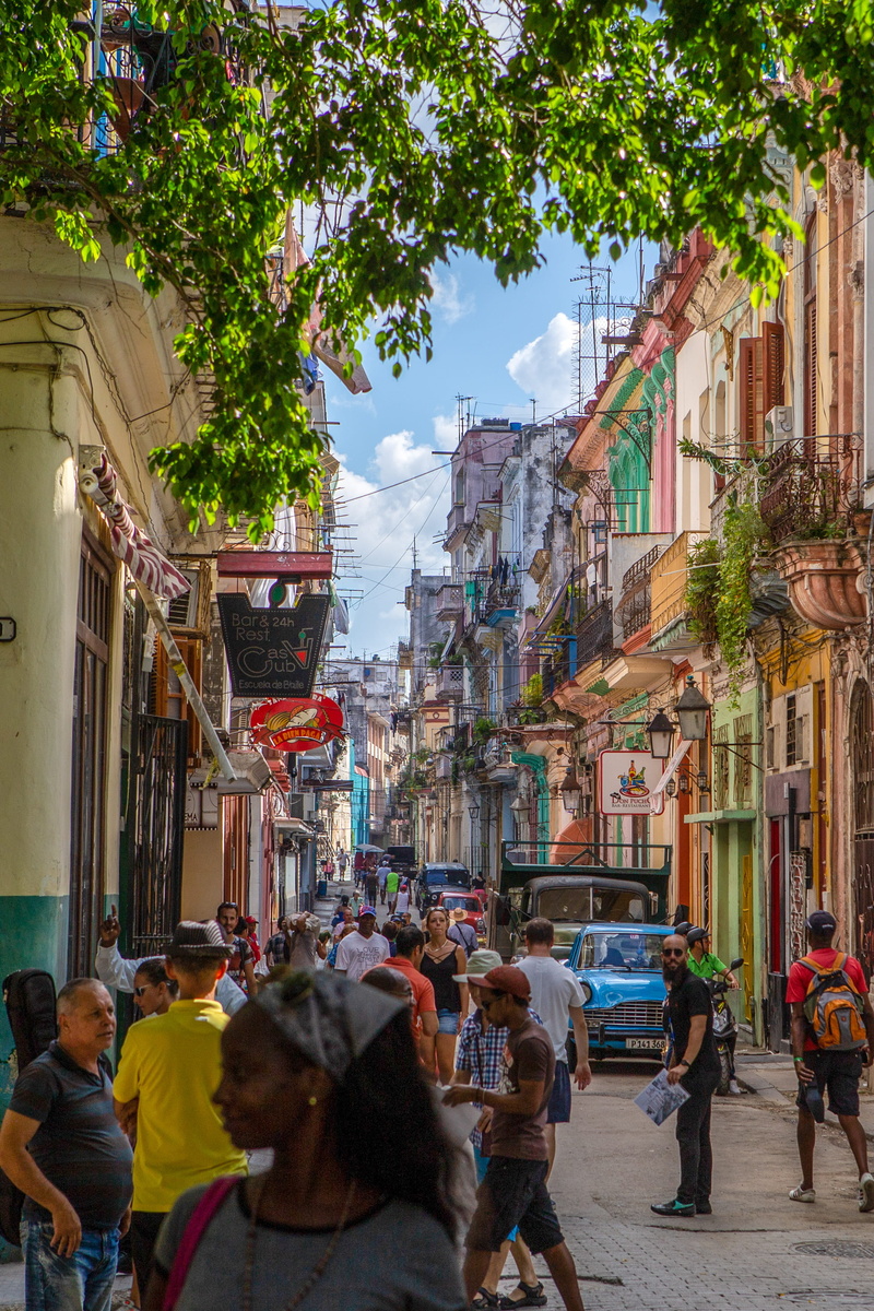 bicycle, built structure, architecture, building exterior, path, real people, apparel, footwear, outdoors, men, pavement, walking, lifestyles, group of people