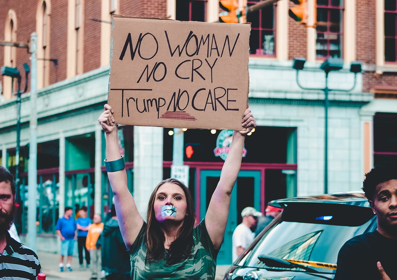 city, democracy, man, focus, arms raised, communication, incidental people, signage, architecture, street, standing, human arm, real people, woman, 2K
