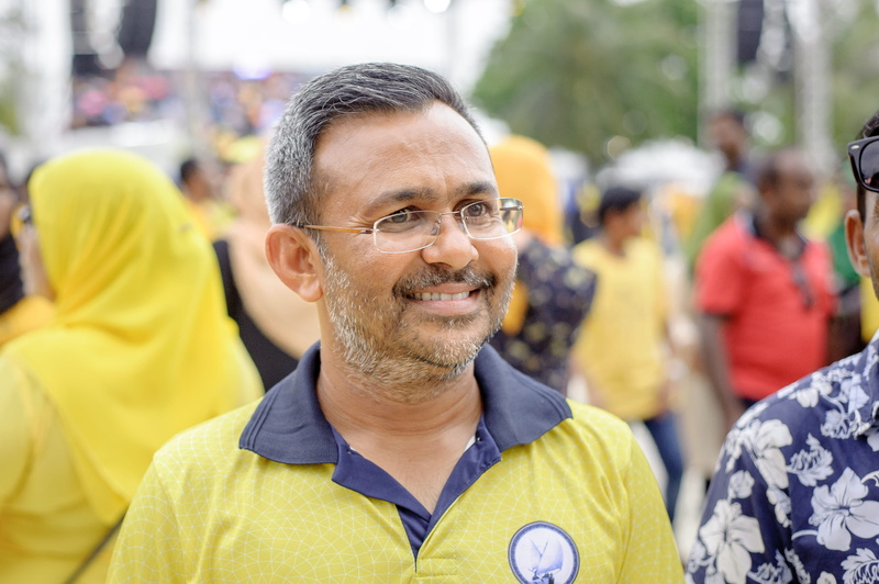 emotion, standing, looking at camera, person, smiling, people, happiness, males, men, demonstration, eyewear, eyeglasses, headshot, day, portrait, mature men