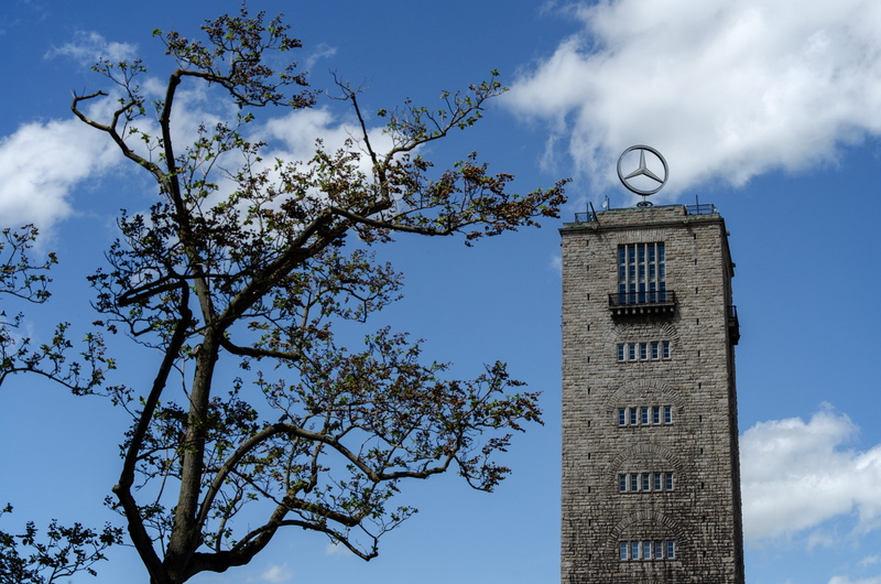 tree, building, building exterior, minute hand, blue, plant, mercedes, office building exterior, low angle view, architecture, main station, day, stuttgart