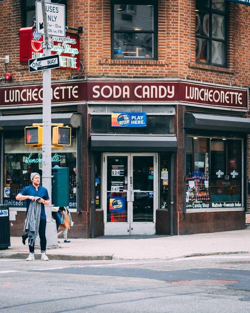 corner store, leisure activity, adult, built structure, incidental people, street, day, store, deli, candy, building exterior, ny, men, street photography