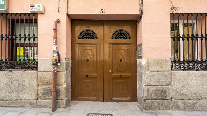 family, closed, exterior, shutter, wrought iron, oxide, day, street, gate, wood, no people, brick, wall, house, arch, iron, safety, old, entrance, architecture
