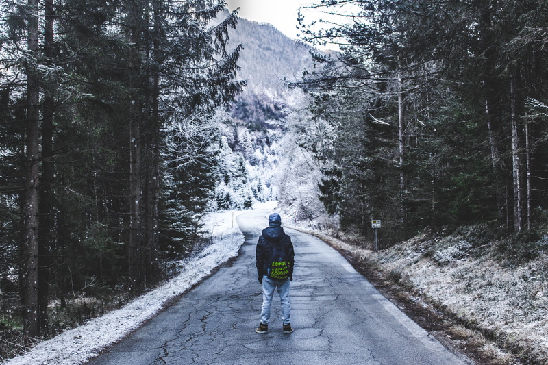 beauty in nature, motion, cold, the way forward, tall, winter, ice, man, walking, leisure activity, mountain, standing, snow, real people, road, front