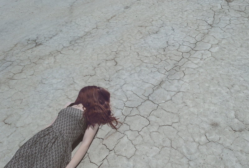 woman, hairstyle, gray, day, side view, crack, cracked, dress, lying, climate, leisure activity, ground, young adult, casual clothing, adult, depression