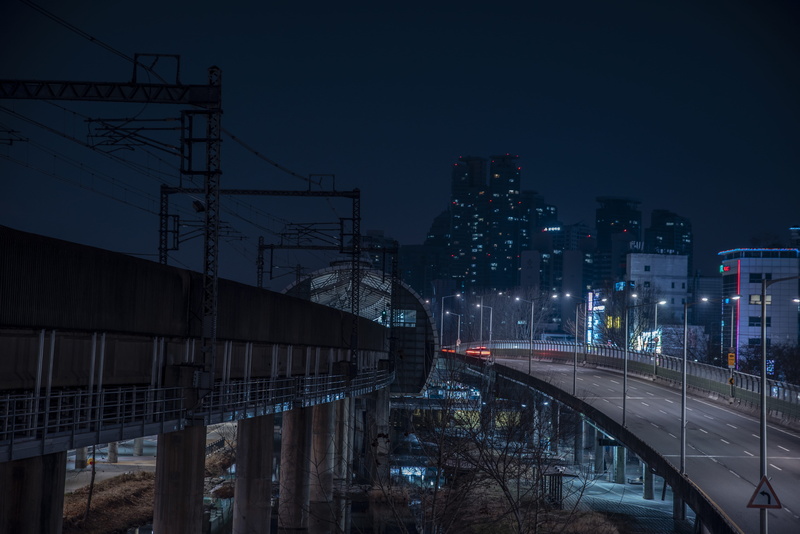 city, street photography, mode of transportation, electricity, bridge - man made structure, sky, urban, concrete, building, building exterior, korea, outdoors