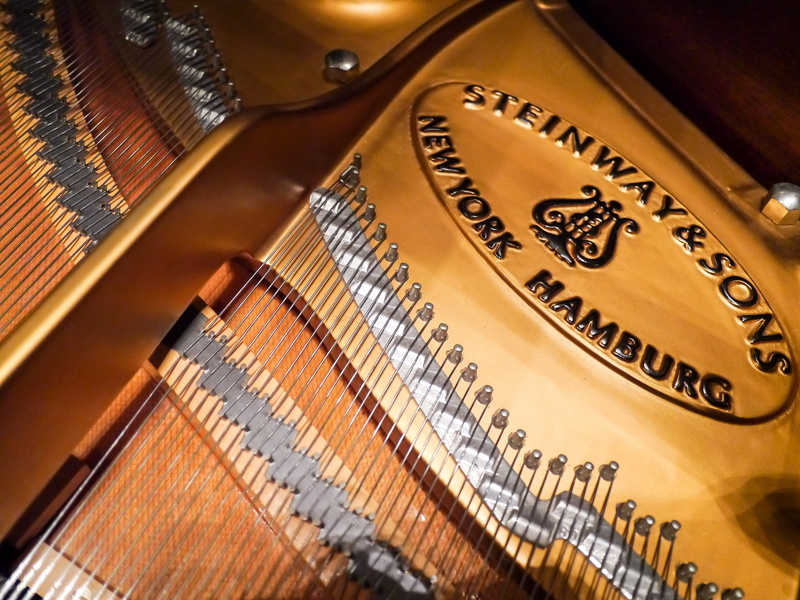 musical instrument string, indoors, finance, wood - material, close-up, musical instrument, arts culture and entertainment, staircase, luxury, consumerism