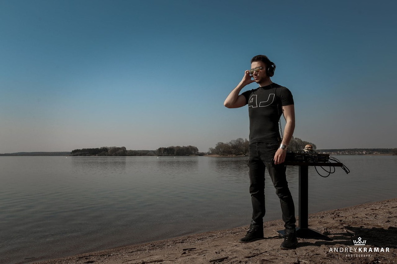Andrey Kramar, sunglasses, short hair, water, headphones, DJ, T-shirt, 720P, wires, bracelets, boots, men, black clothing, shore, pants