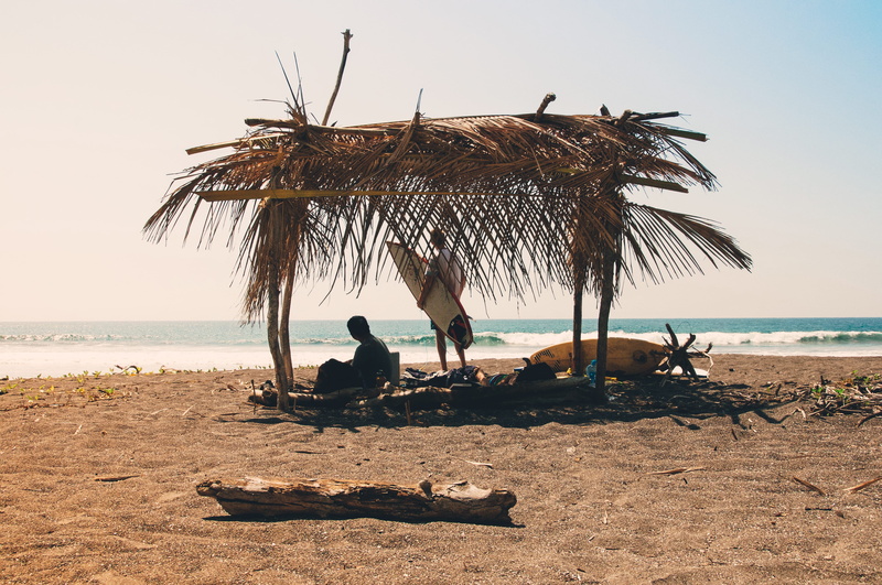 water, near, brown, 4K, shack, vacation, outdoors, surfboard, hut, wafe, thatched roof, sitting, tranquil scene, people, holiday, clear sky, explore, reclining