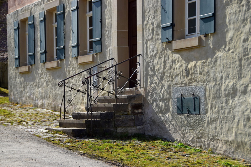 building, direction, plant, home, apartment, staircase, no people, antique, stairs, residential district, metal, road, outdoors, sunlight, day, external staircase