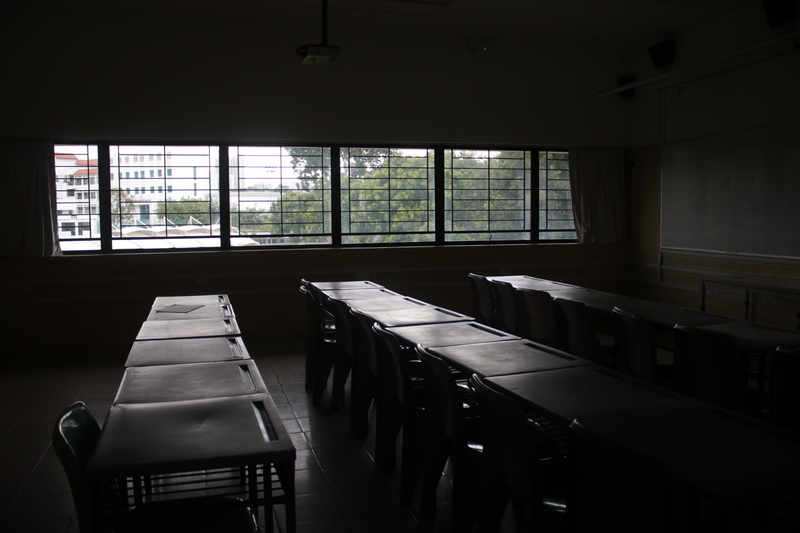 glass, classroom, in a row, education, building, absence, window, seat, alone, built structure, furniture, school, indoors, dark, no people, acs (independent)