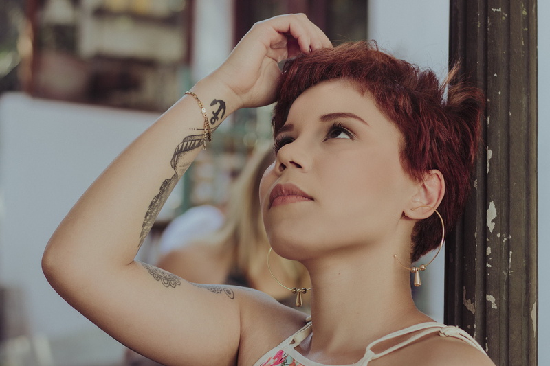 tattoo, short hair, beautiful woman, leisure activity, headshot, hairstyle, one person, jewelry, looking, hair, young adult, women, adult, contemplation