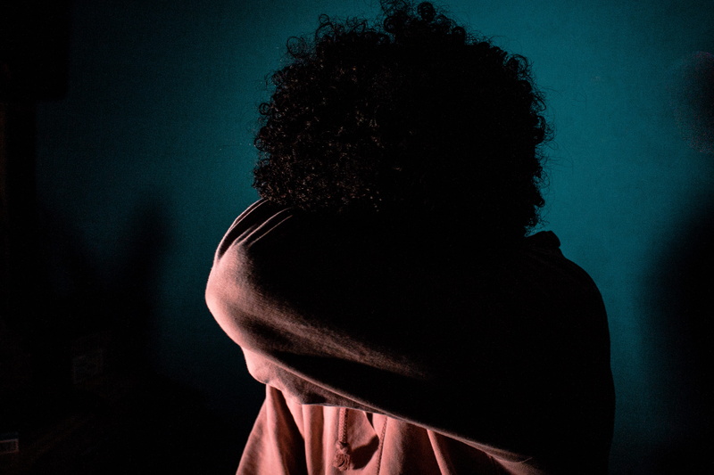 indoors, sadness, covering, night, colored background, new, fashion, obscured face, depression - sadness, up, adult, rear view, emotion, females, hairstyle