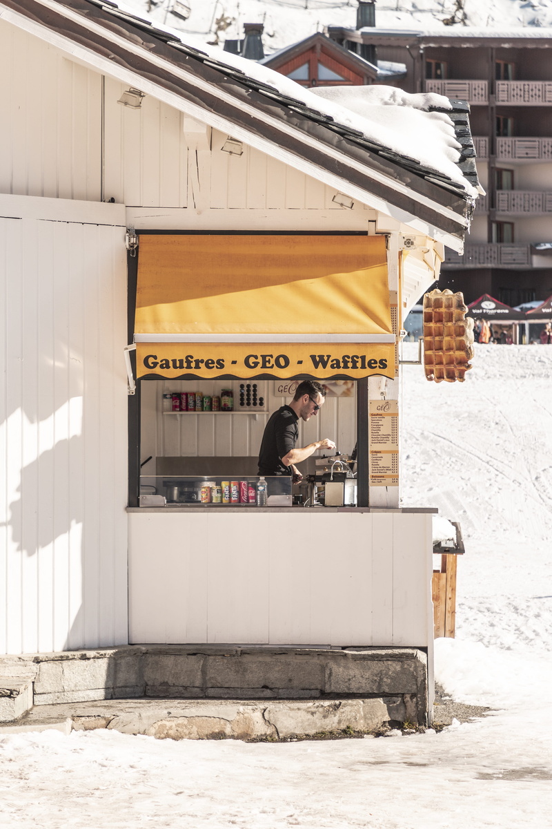 human, day, built structure, indoors, standing, waffles, warm clothing, shelf, public transportation, store, building exterior, lifestyles, building, urban