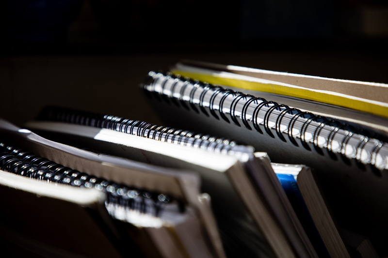file folder, furniture, room, spiral, close-up, library, technology, wood, electronics, education, musical instrument, leisure activities, in a row, musical equipment
