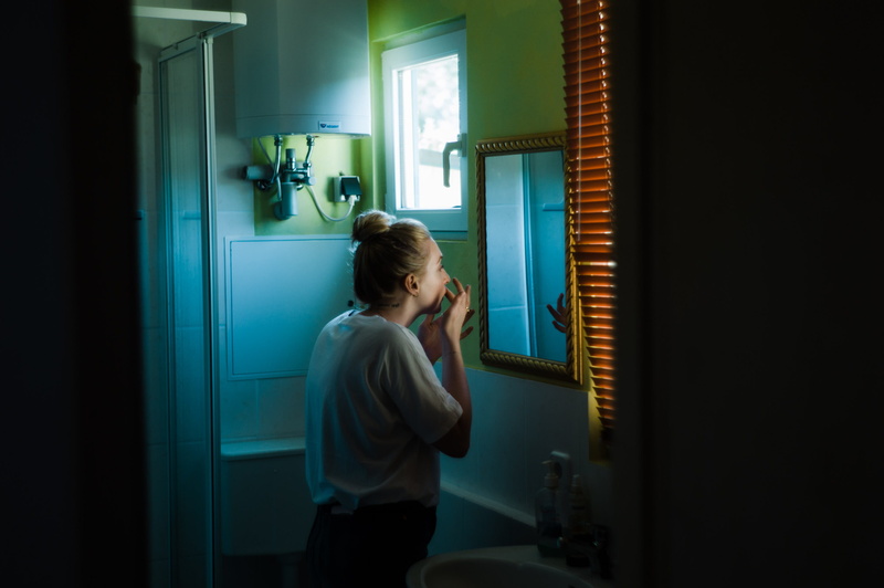 reflection, room, furniture, domestic room, shelf, women, person, home, bathroom, side view, window, home decor, facing, 2K, standing, finger, cupboard