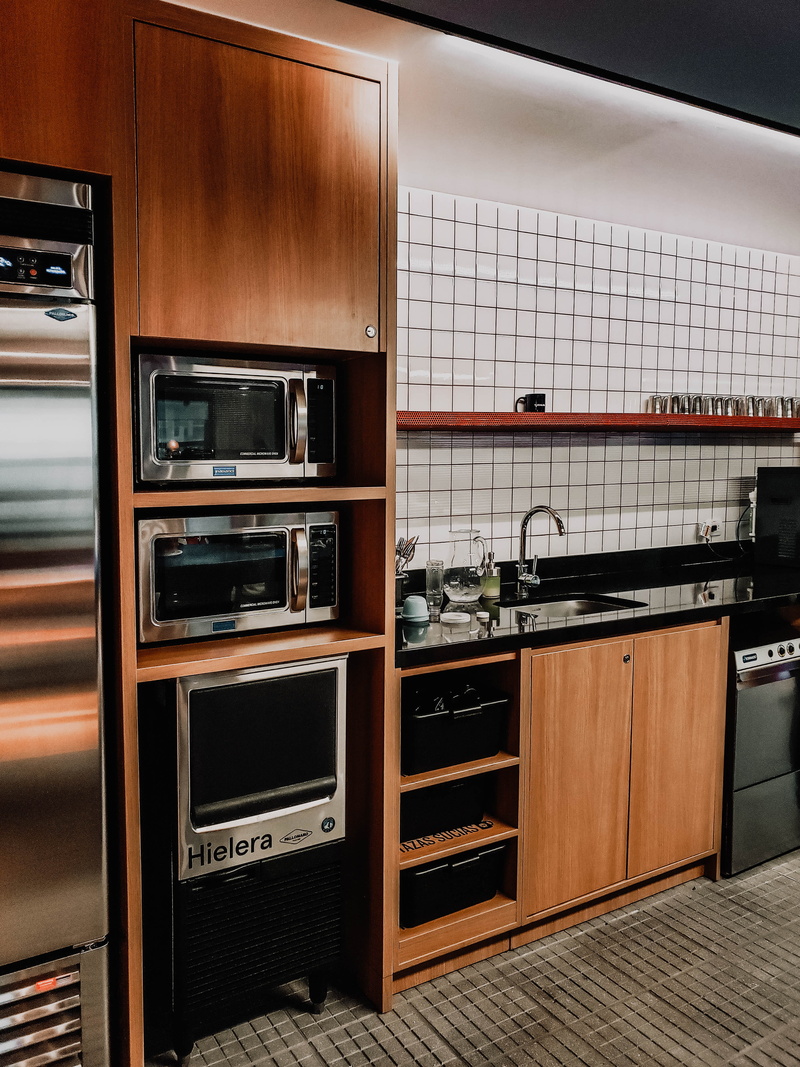 wework, stove, food and drink, interior design, cabinet, container, indumentary, microwave, kitchen island, kitchen, furniture, architecture, oven, home interior