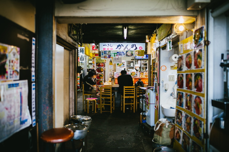retail, tsukiji, real people, lighting, indoors, focus on background, rear view, men, for sale, lifestyles, architecture, market, furniture, building, small business