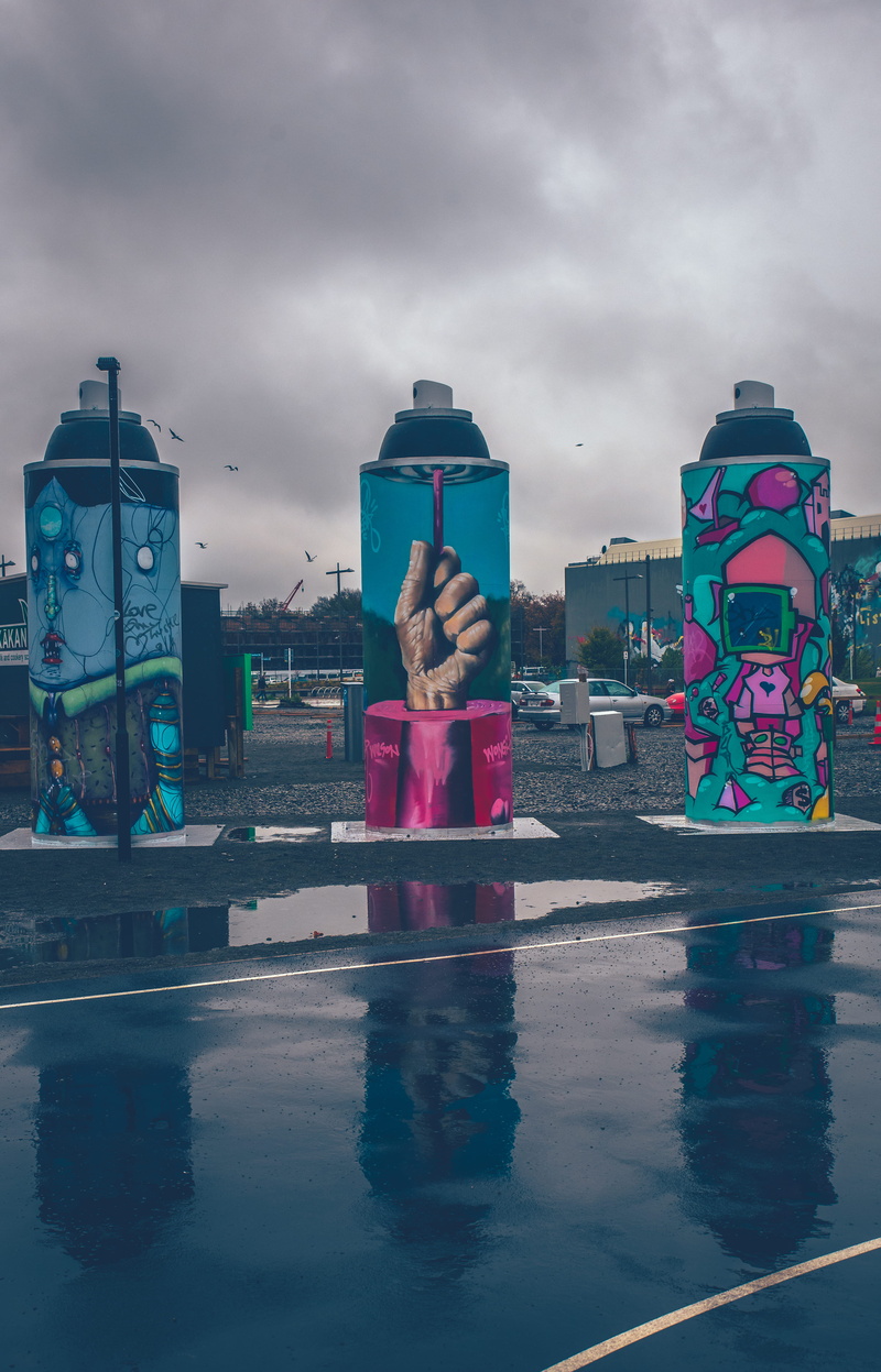 built structure, building exterior, human representation, waterfront, women, cloudy, mural, dusk, rain, cloud - sky, gray, art, themed, architecture, sky