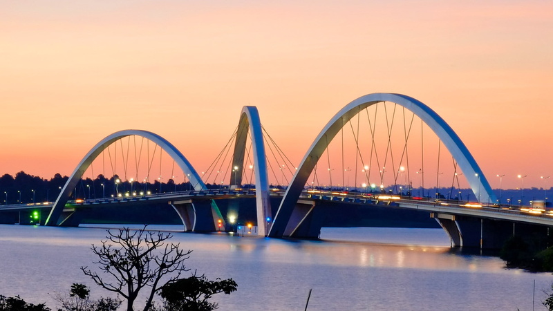 transportation, cityscape, travel, steel arch bridge, bridge, sky, connection, orange color, arch bridge, architecture, engineering, built structure, river