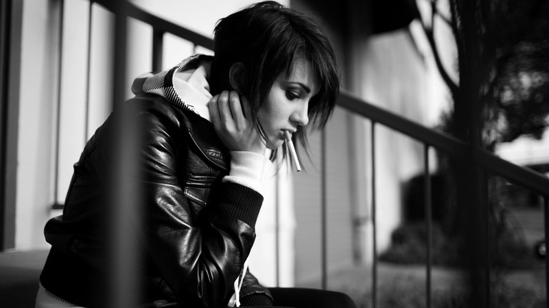 beautiful woman, sitting, focus on foreground, window, beauty, real people, hairstyle, adult, bangs, depression - sadness, one person, young adult, cigarettes