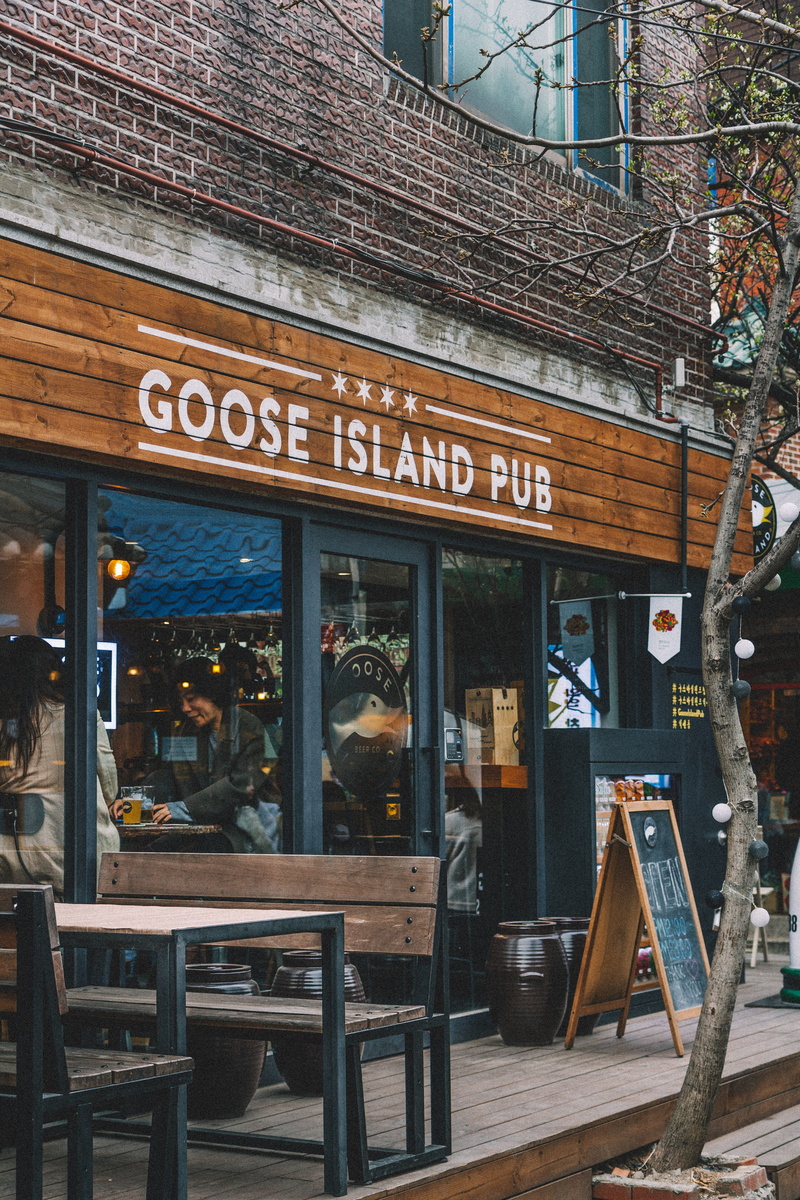 handrail, bakery, pub, menu, island, shop, meal, restaurant, store, goose, plywood, shelf, coffee shop, banister, western script, city, cafeteria, business