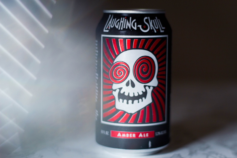 western script, indoors, fun, container, communication, united states, sign, prisms, beer, illuminated, laughing skull, creativity, label, craft beer, studio shot