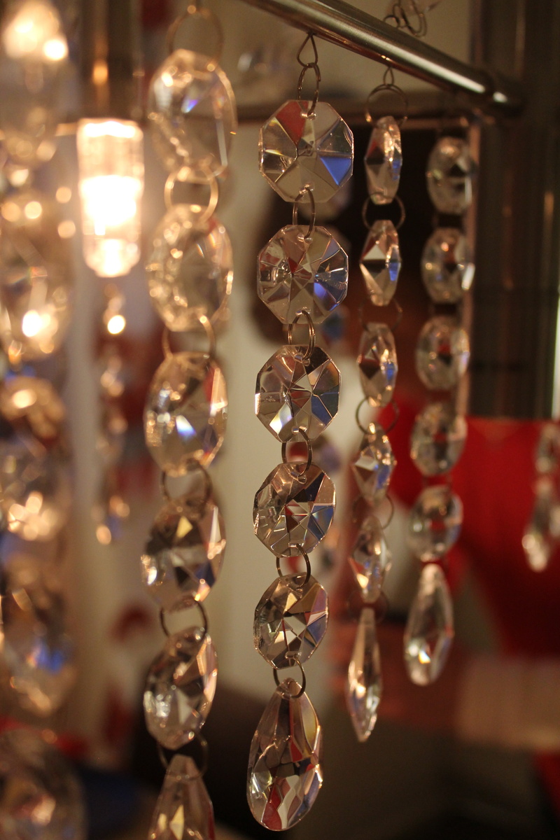 selective focus, design, indoors, luxury, retail display, close-up, large group of objects, no people, light, illuminated, shiny, decoration, crystal, low angle view