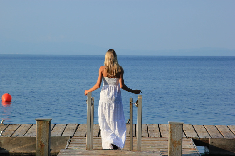looking at view, dock, hair, fashion, blond hair, leisure activity, vacation, lifestyles, wood - material, daytime, one person, sun, 5K, horizon over water