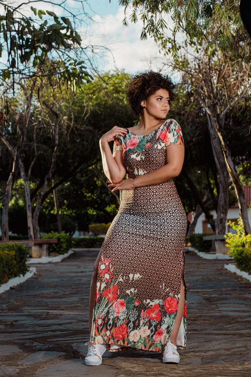 clothing, wearing, cap, scoop, plants, day, dress, beautiful woman, one person, neck, park, leisure activity, sleeved, floral, person, pretty, wear, plant