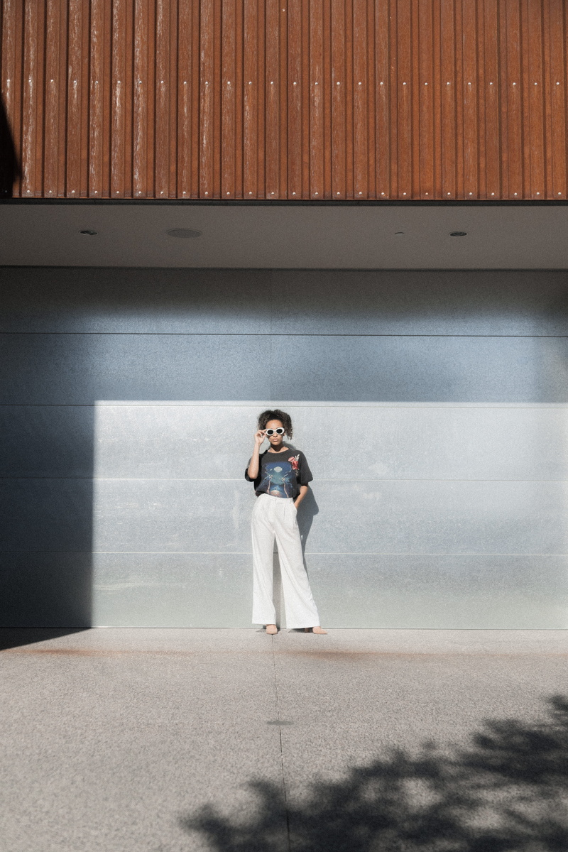 daytime, real people, style, fashion, concrete, clothing, curly hair, girl, building, front view, adult, outdoors, near, urban, black woman, 5K, sun, architecture