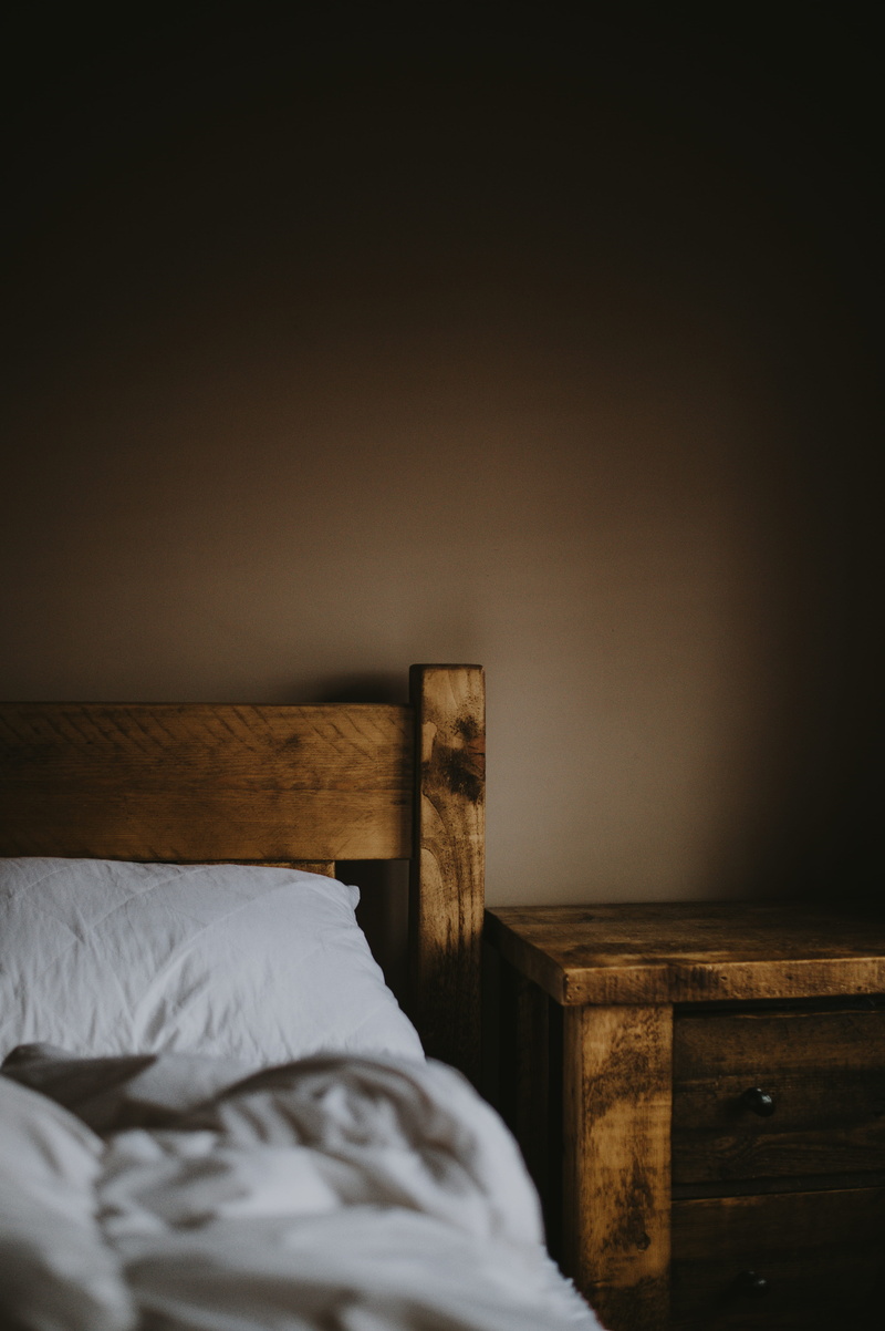 bed, sleeping, absence, brown, copy space, duvet, furniture, white color, bedroom, linen, wall - building feature, indoors, comfortable, home, room, no people