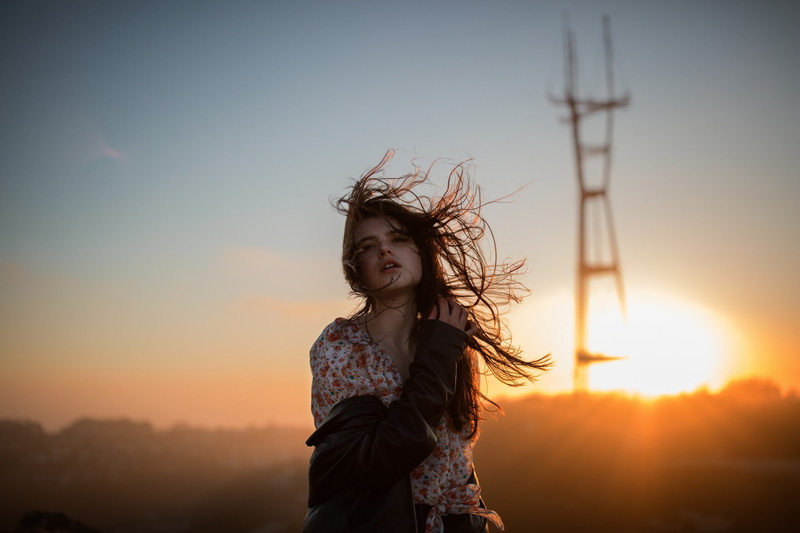 sunlight, leather jackets, young women, long hair, sunset, casual clothing, Sun, 1080P, standing, sun rays, women, hair, leisure activity, one person